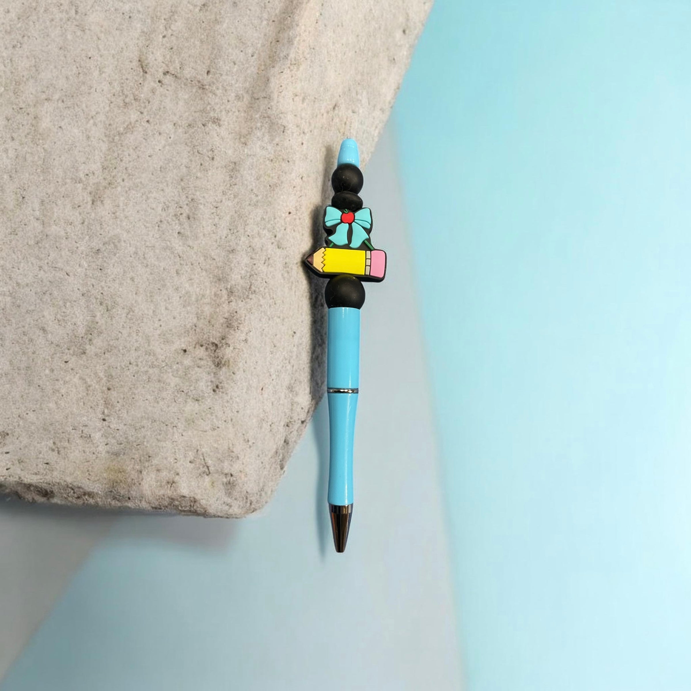 Blue Ink Pen with Ribbon and Pencil