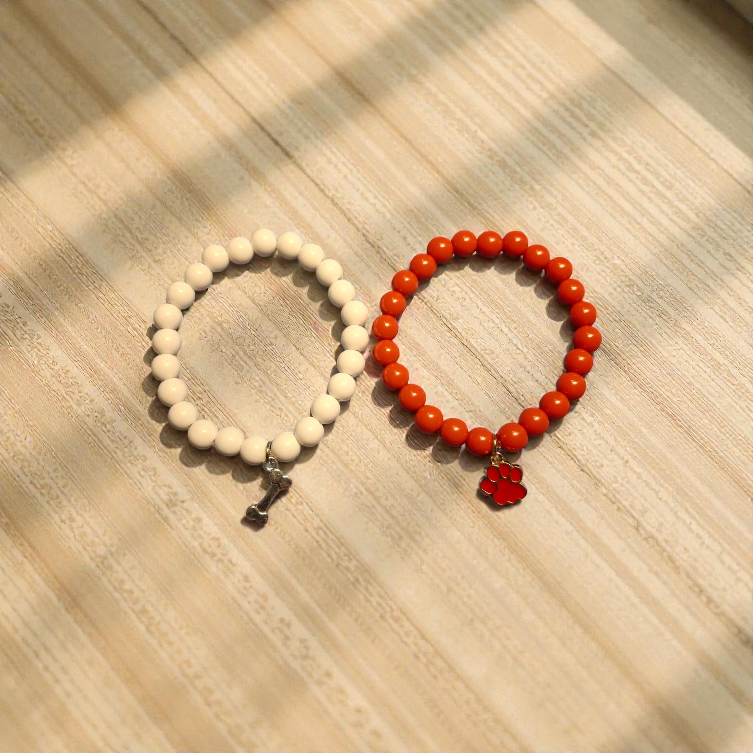 Red Bracelet and White Bracelet with Paw and Bone Charms