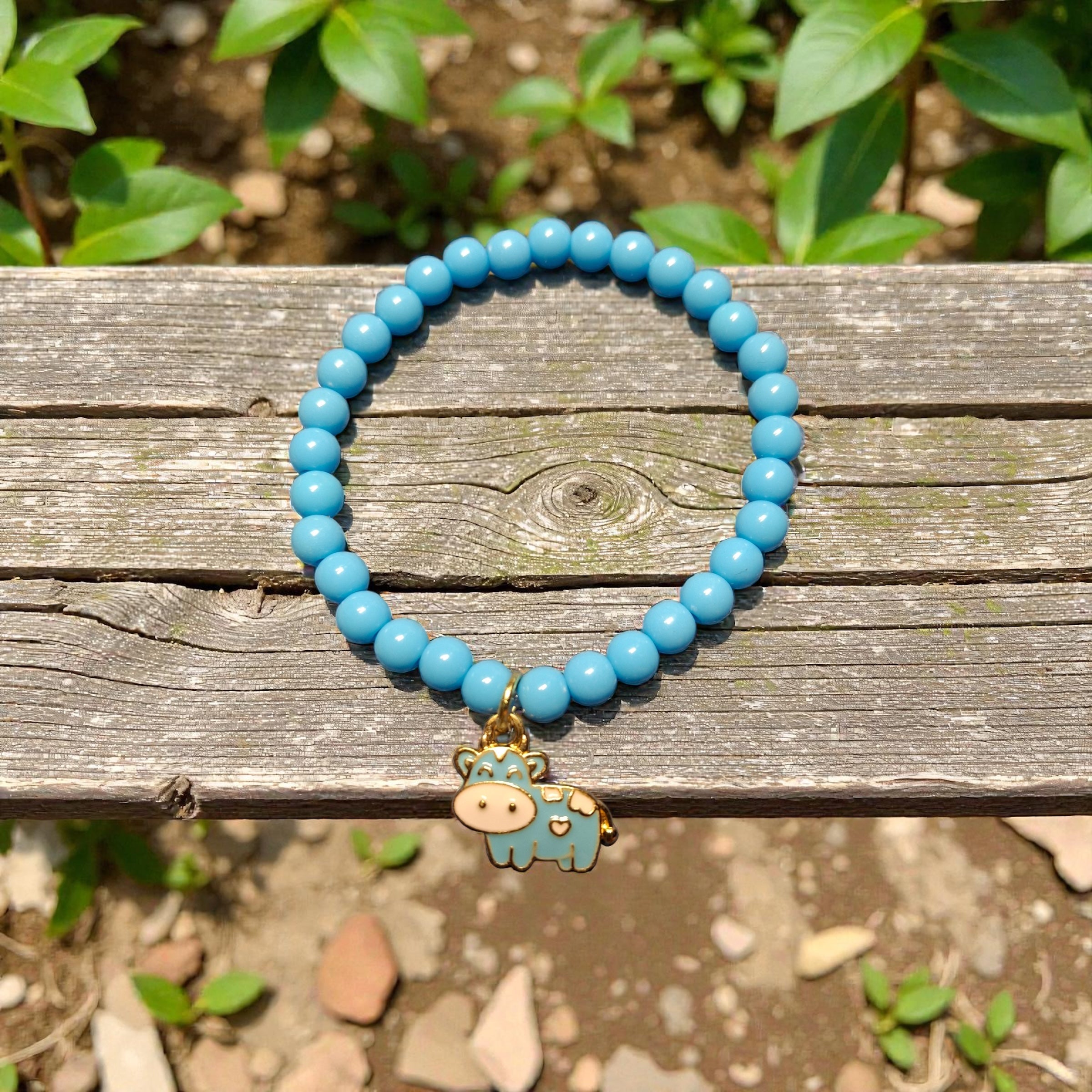 Light Blue Round Beads with Light Blue Cow Charm