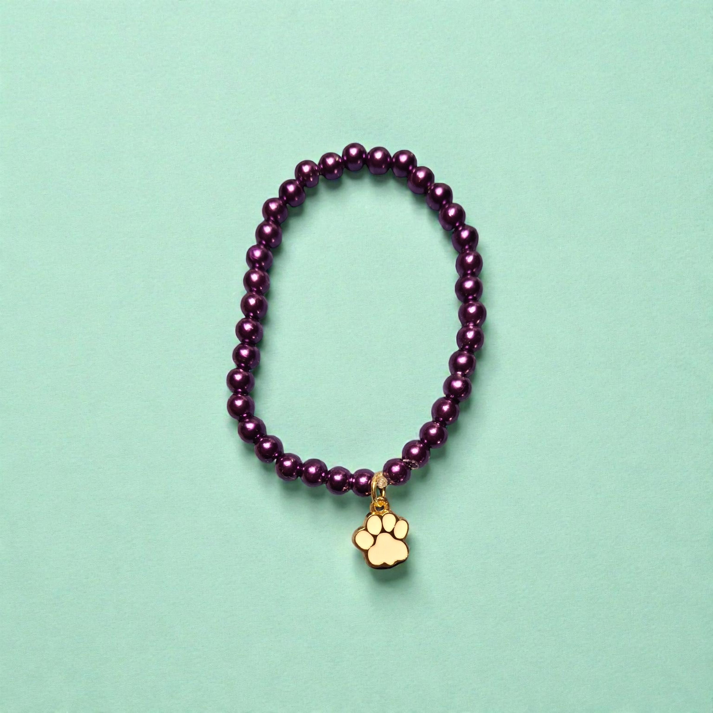 Purple Bead Bracelet with White Paw Charm