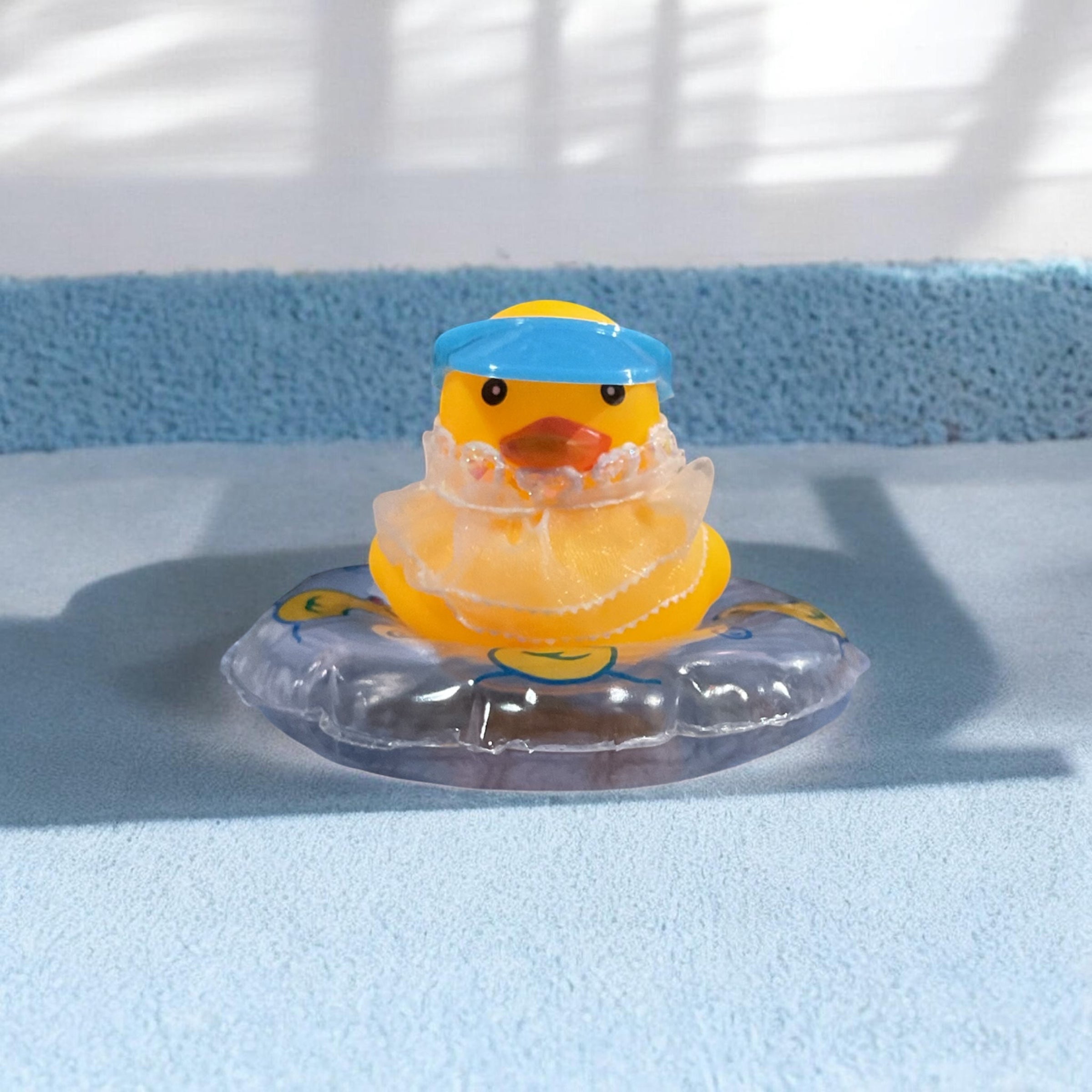 Yellow Rubber Duck on inter tube with Blue Visor