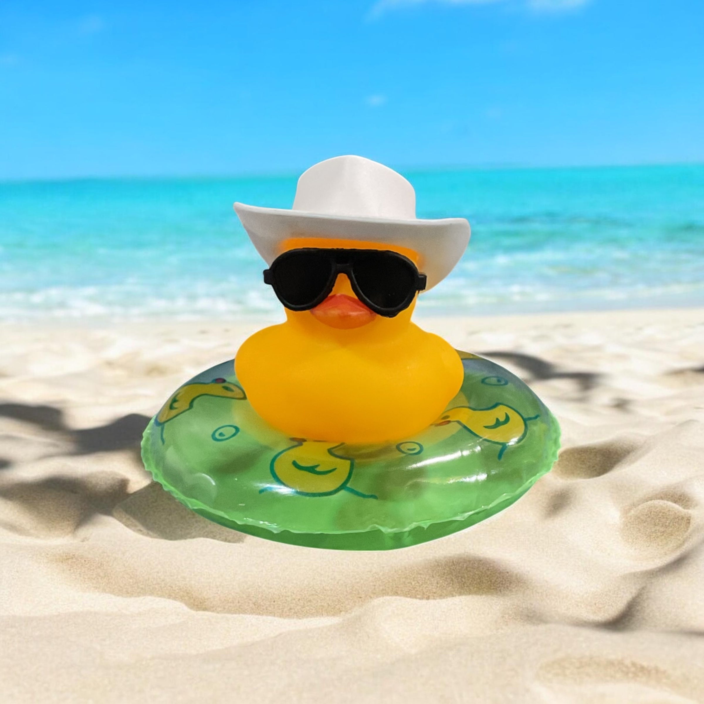 Yellow Rubber Duck on inter tube with White Cowboy Hat and Black Sunglasses