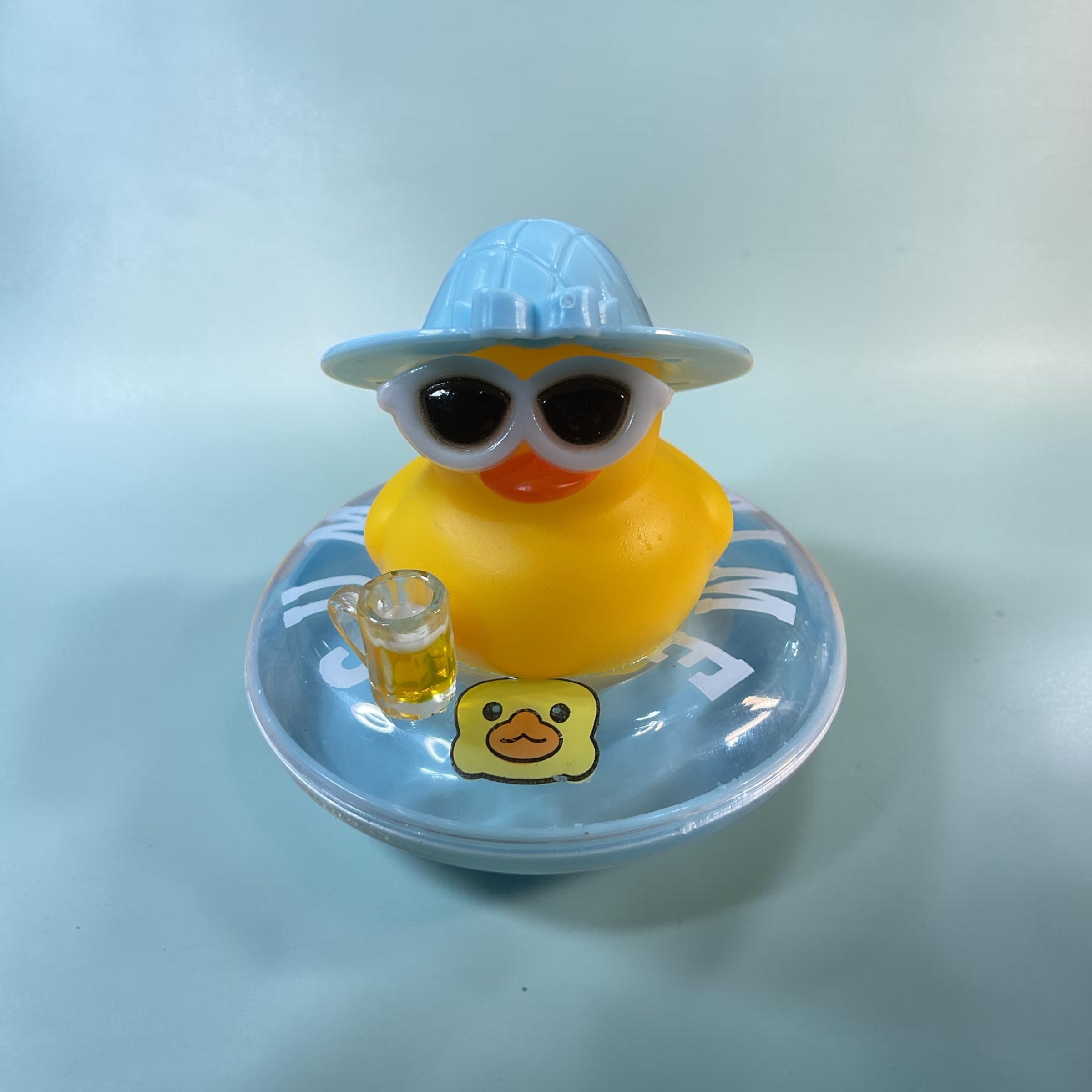 Yellow Duck on Blue Plastic Tube