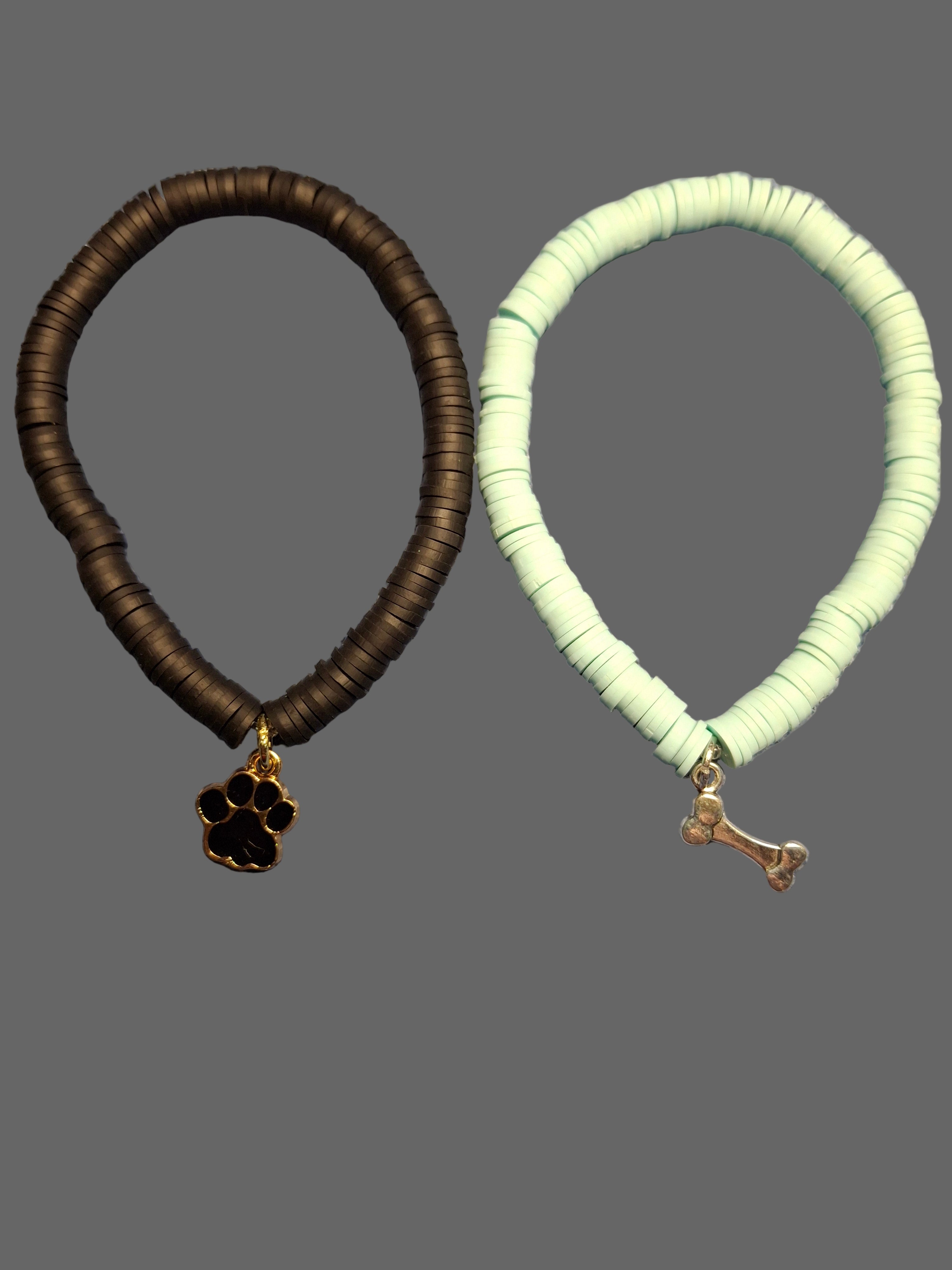 One Mint Green Bracelet with Bone Charm, One Black Bracelet with Paw Charm
