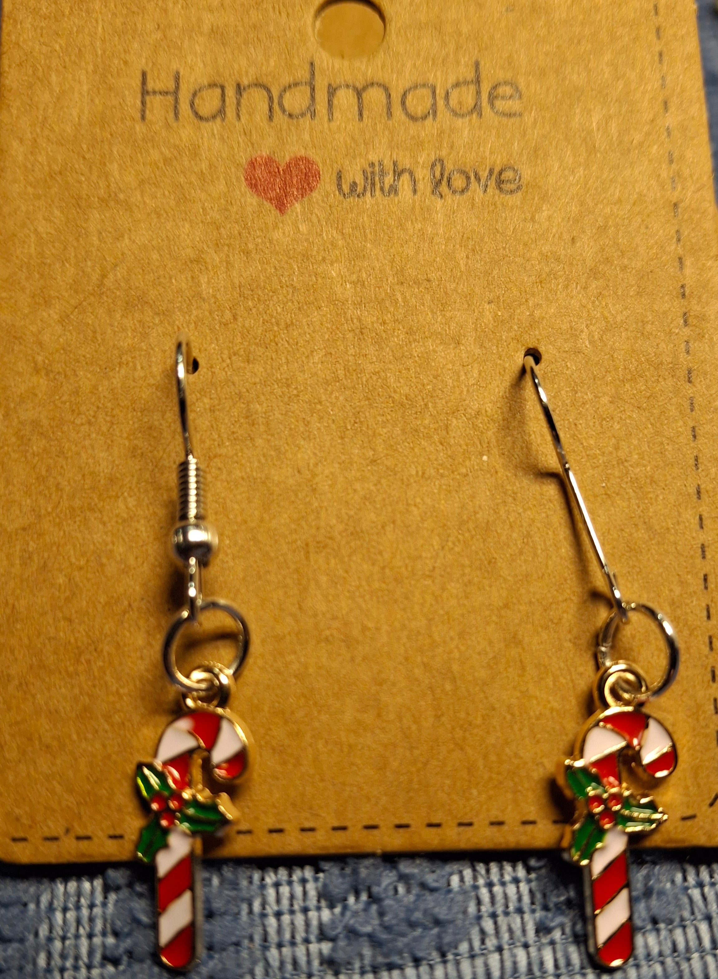 Handmade candy cane-shaped earrings on a brown card with 'Handmade with Love' text.