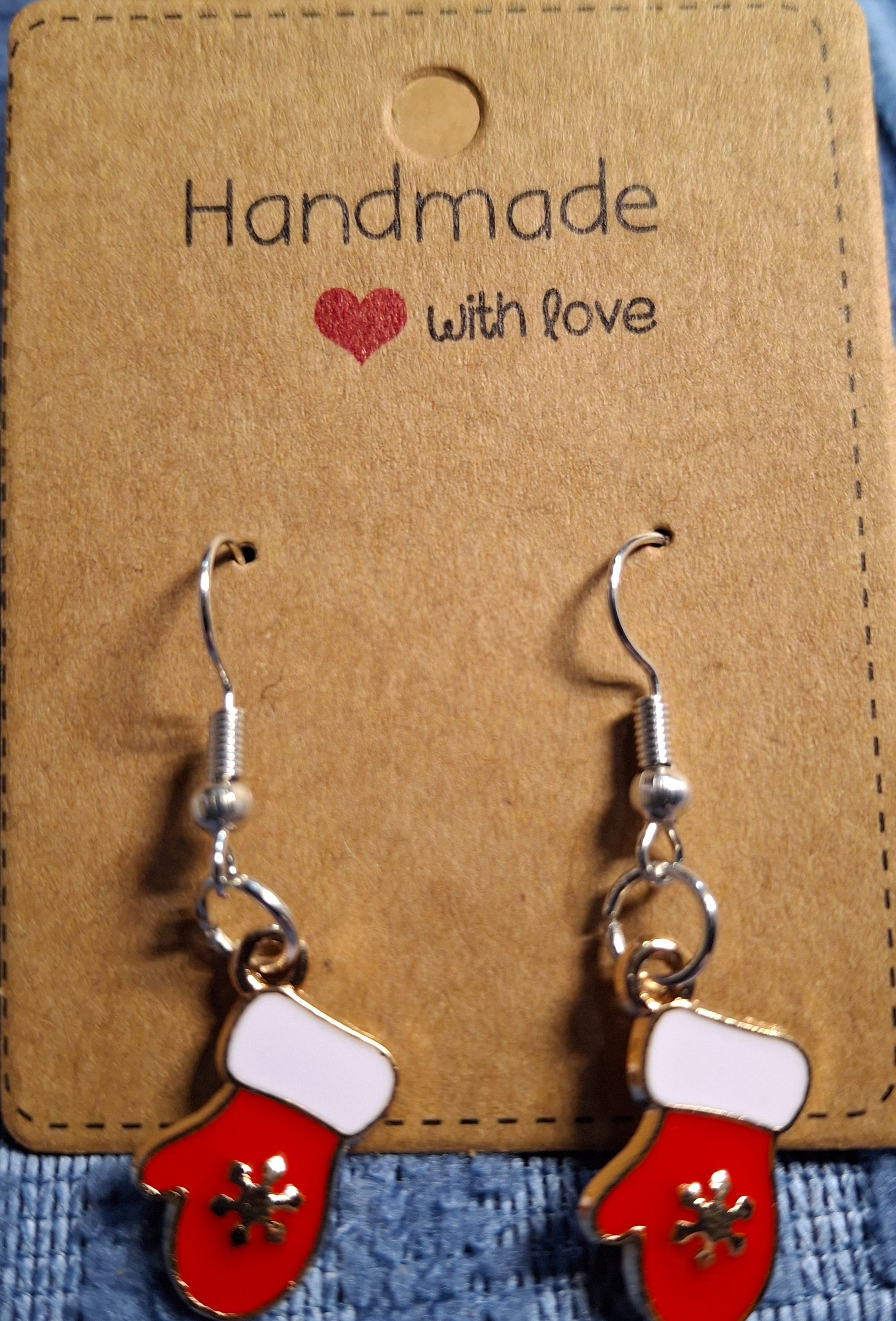Red mitten earrings on a 'Handmade with Love' card
