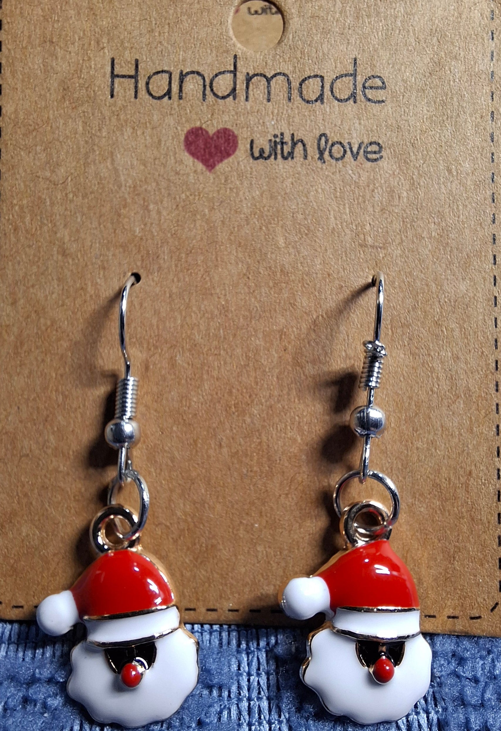 Handmade Santa Claus earrings on a brown card with 'Handmade with love' text.