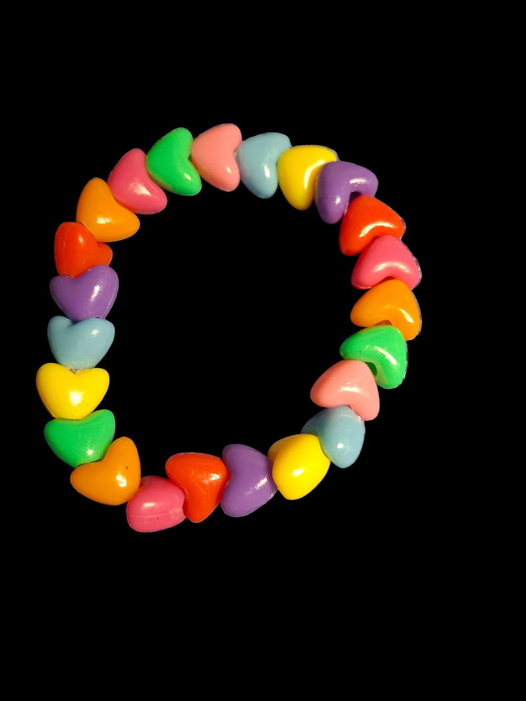 Colorful heart-shaped bracelet on a black background