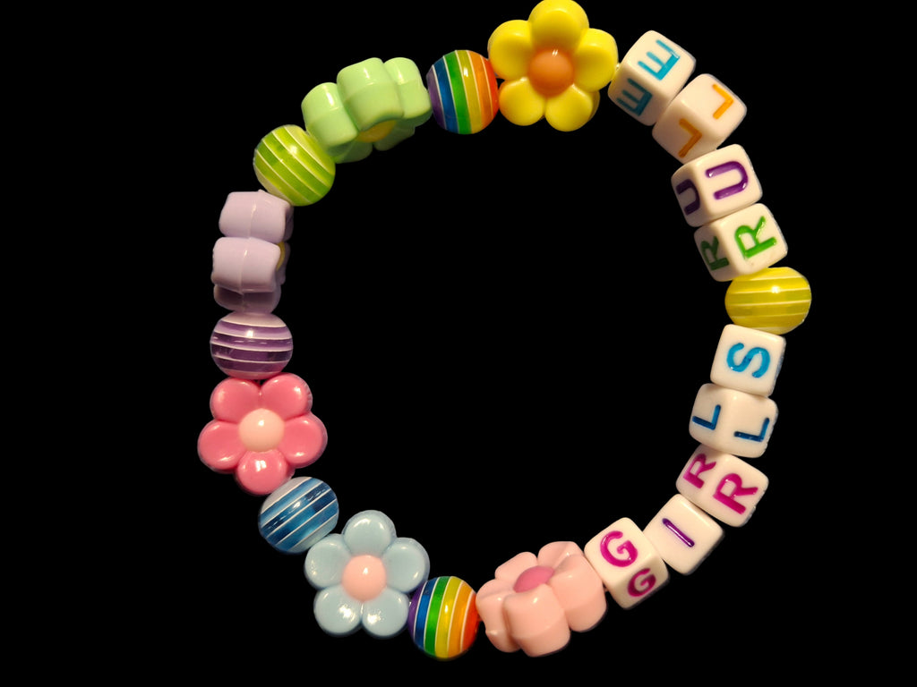 Colorful beaded bracelet with flowers and letter beads on a black background