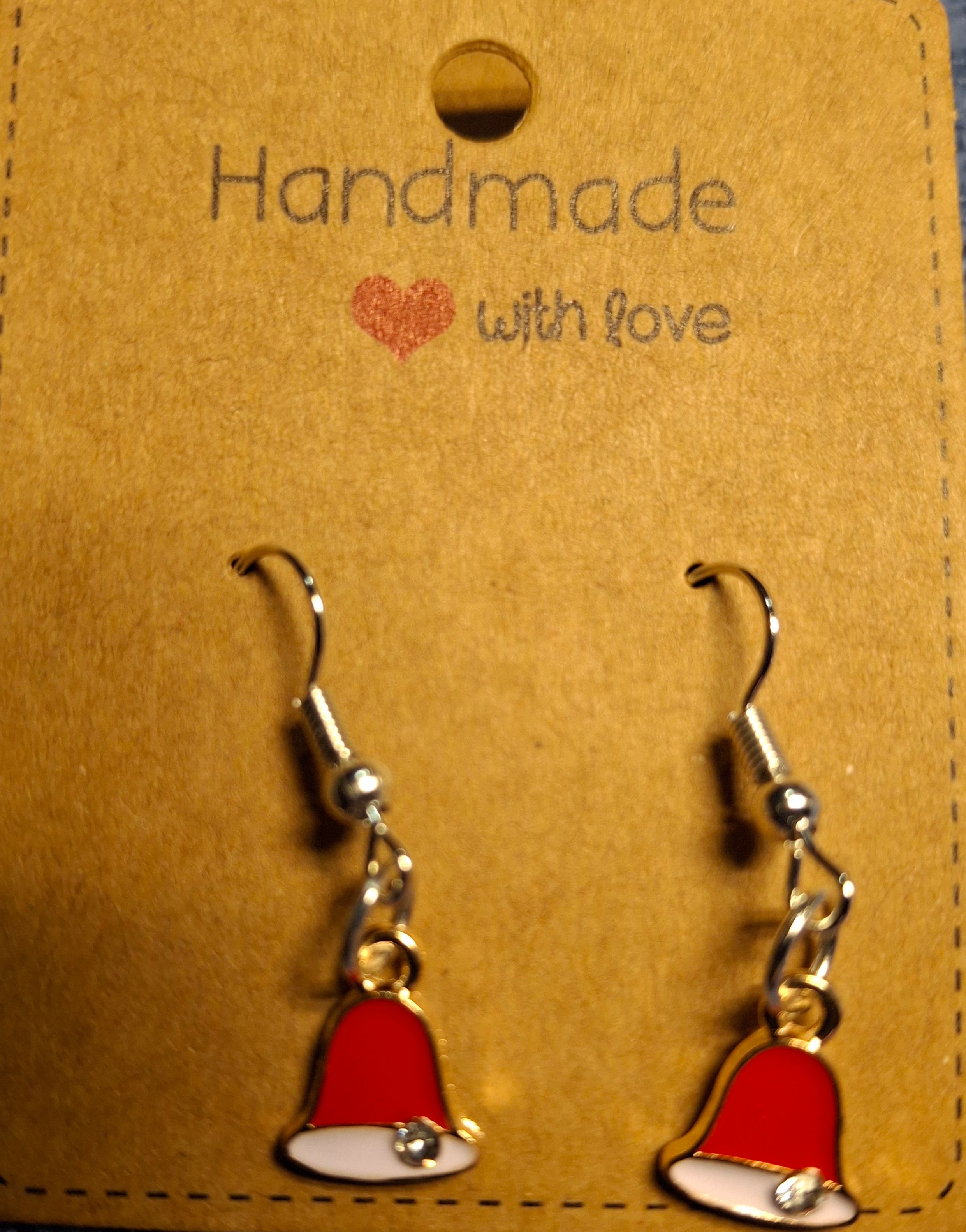 Red bell earrings on a 'Handmade with love' card