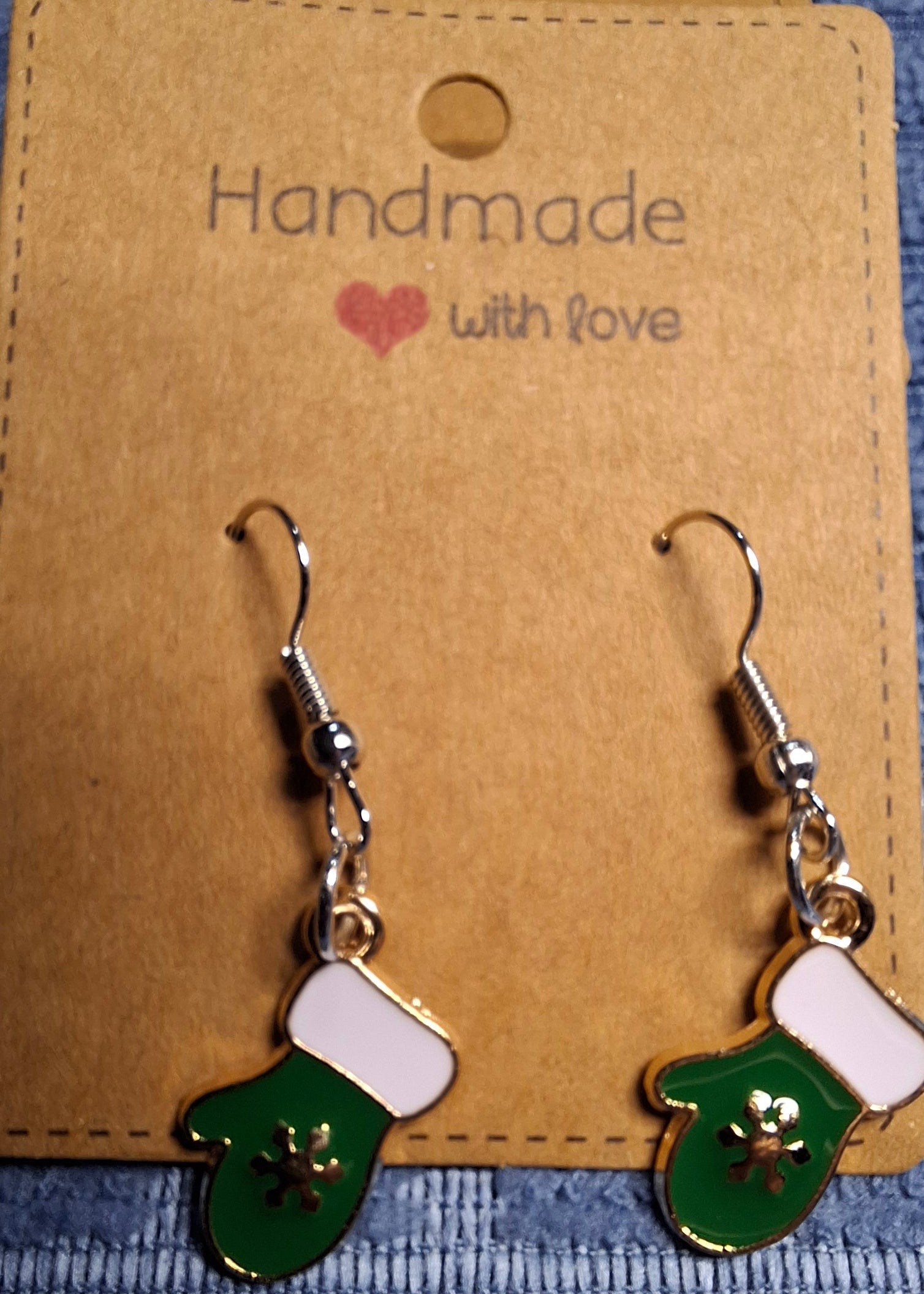 Green and white earrings on a 'Handmade with Love' card